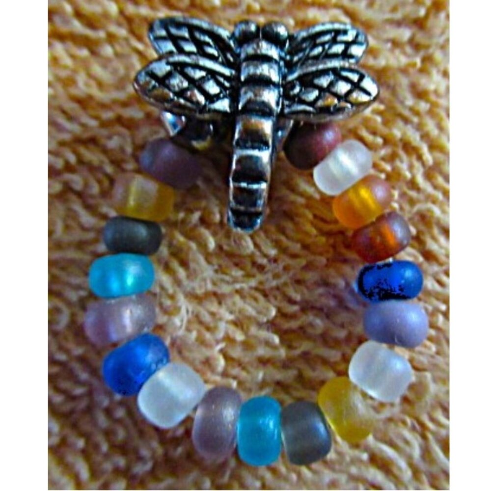 BUTTERFLY ON  RING OF MULTI-COLOR BEADS